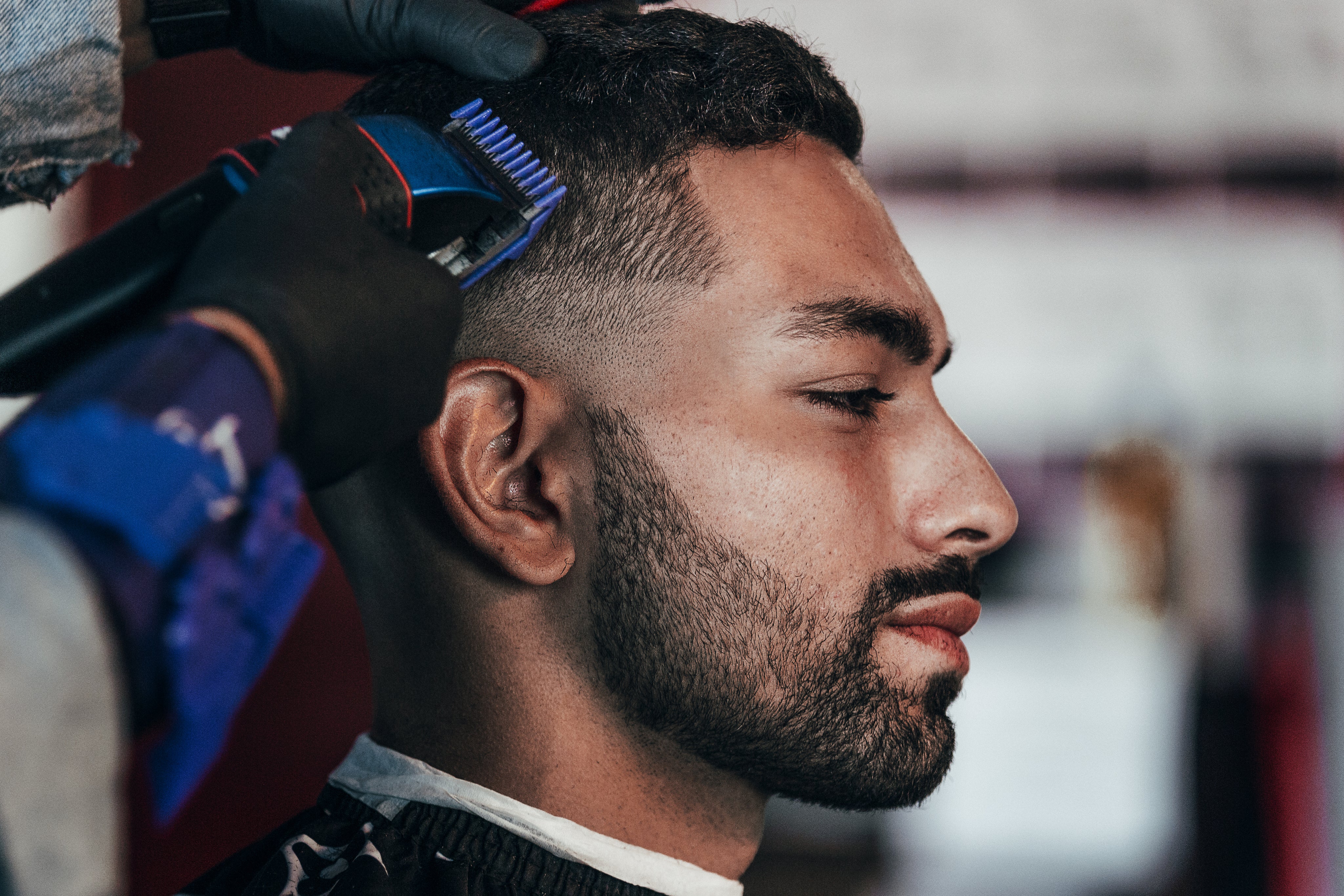 files/man-gets-his-hair-trimmed-at-the-barbershop.jpg
